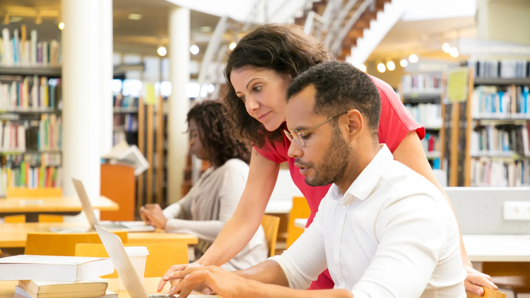 Students studying together in a library