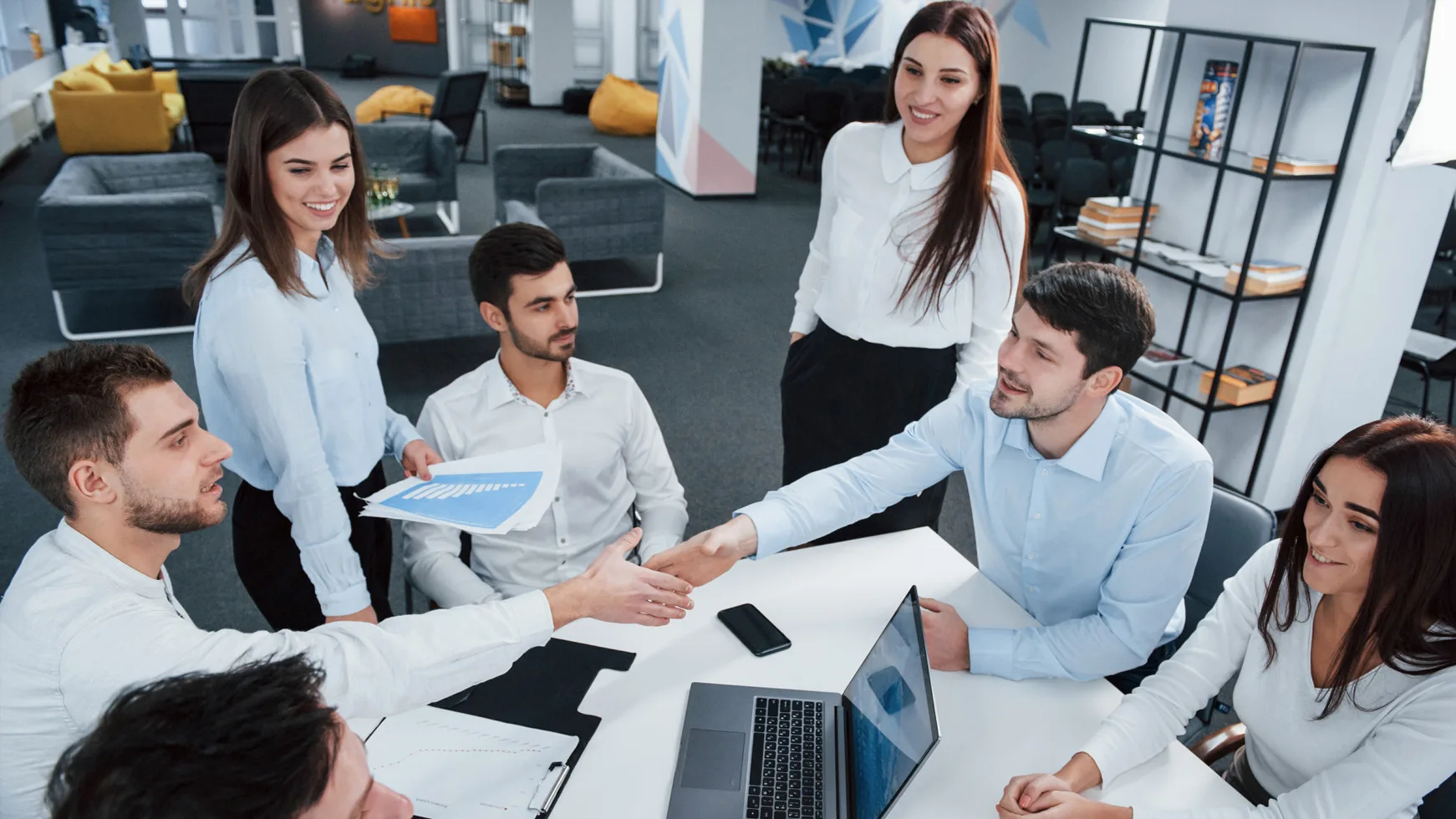 Professional services team meeting around a table